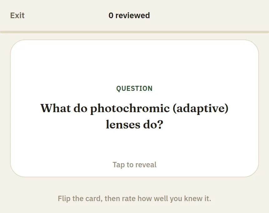 Flashcard review screen showing a spaced-repetition question card asking what photochromic adaptive lenses do, with a Tap to reveal prompt